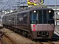 A 30000 series half-set with a gangwayed driving car leading in February 2004