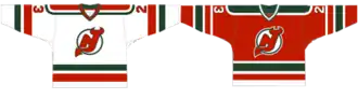 Two jerseys, the left primarily white, the right mostly red. Both feature red, white and green stripes at the bottom, the sleeves and the shoulders.
