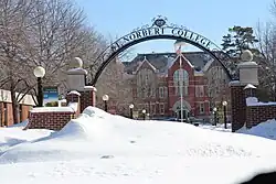 The entrance arch to Baer Mall and Main Hall