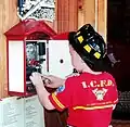 A large alarm gong that visitors may operate. One of the many hands-on exhibits in the Aurora Regional Fire Museum.