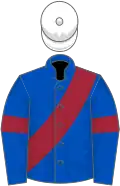 Royal blue, maroon sash and armlets, white cap