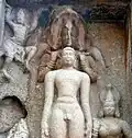 Sculpt image portraying Pārśvanātha sheltered by his yakṣa Dharaṇendra at Kalugumalai Jain Beds