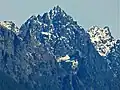 Merchant Peak centered, with the southeast subsidiary subpeak (5,831&nbsp;ft) to the right. The subpeak is mistakenly labelled as Merchant Peak on old USGS maps.