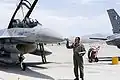 An officer performs a post-flight inspection after the Griffins arrive at Red