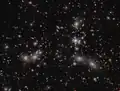 Pandora's Cluster observed by James Webb Space Telescope's NIRCam as part of UNCOVER program (15 February 2023).[15]
