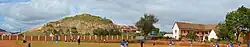 The village of Ambatomanga with the immense granite rock overlooking it as a background