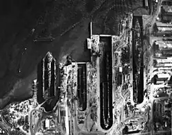 Pearl Harbor dry docks aerial July 1942, Right to left YFD-2 (with Alywin), Dry Dock 3 (with Growler and Nautilus), Dry Dock 2 (with Litchfield and ARD-1) and Dry Dock 1 (with West Virginia)