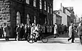 People gather in front of the House of the Althing.