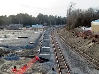Foundations for a railway platform next to a rail line