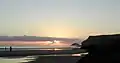 Puffin island and Pentire Point at sunset.