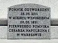 The plaque at the base of the monument.