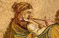 Street musician, Pompeii. Apparent reed or wood-bodied instrument.