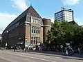 Post office northwest corner at Viestraat along Oudegracht (Old Canal) with the Neudeflat to the right, Utrecht, 2010.