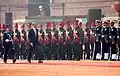 U.S. President Barack Obama inspecting the company with Pooja Thakur in 2015.