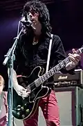Cadogan with Primal Scream in 2009