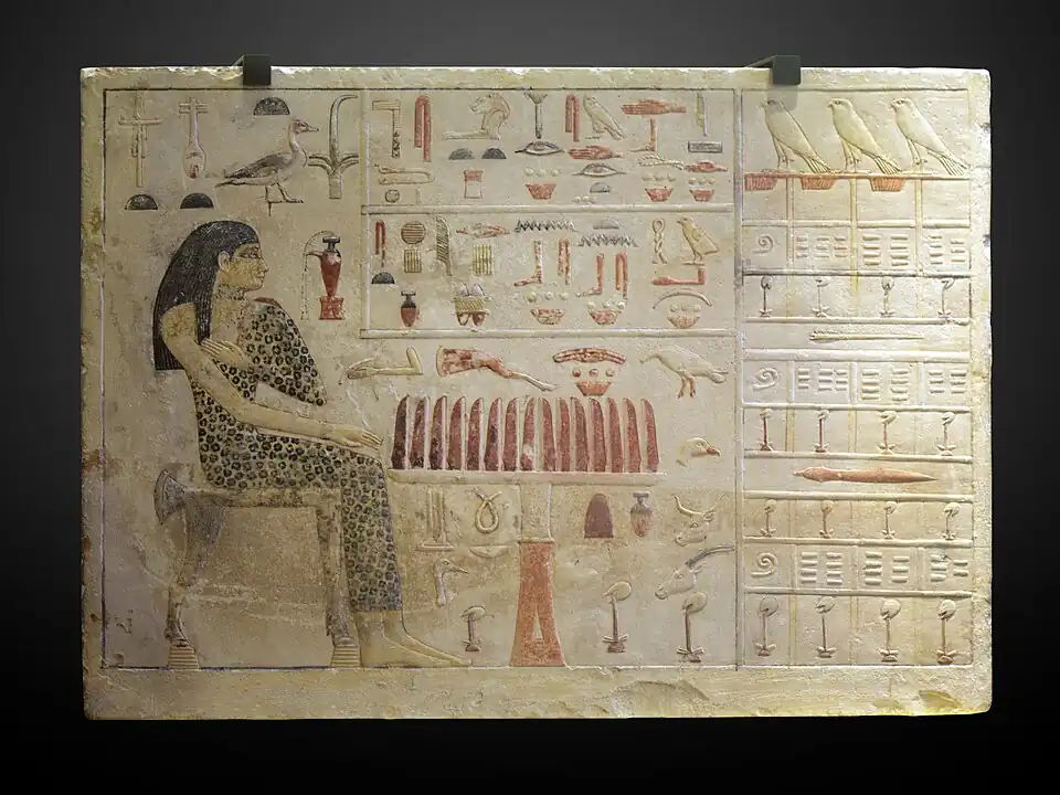 Stele of Princess Nefertiabet eating; 2589-2566 BC; limestone & paint; height: 37.7&nbsp;cm (147⁄8 in.), length: 52.5&nbsp;cm (205⁄8 in.), depth: 8.3&nbsp;cm (31⁄4 in.); from Giza; Louvre (Paris). This finely executed relief represents the most succinct assurance of perpetual offering for the deceased.