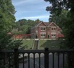Two-story building on a hill.