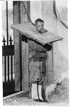 Man with head in cangue, Shanghai c. 1870–72