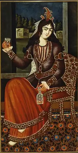 Woman holding a bottle and glass.
