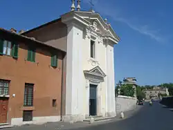 A two-story building with a classical pediment and pillars