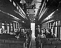 Railroad workers inside the car for a service.