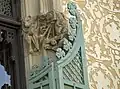 A rat with a camera, one of the sculpture compositions at the main facade