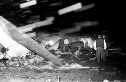 Responders search the wreckage of Capital Airlines Flight 67.