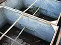 Two of the water storage galvanised tanks.