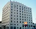 Built in 1928 as the Royal Edward Hotel, the eight-storey Royal Edward Arms is the oldest "highrise" in Fort William and was designed by Dorr & Dorr architects of Minneapolis.[36] The upper reaches of the building is decorated with an Art Deco stylization of Gothic ornamentation.[37] Today the building is used for low income housing,[38] but during its heyday hosted many famous individuals, including Her Majesty Queen Elizabeth II.[39]
