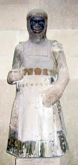 Saint Mauritius on the wall behind one of the statues of the grave of King Frederik II in Roskilde Cathedral. 13th Century statue of Saint Maurice from the Magdeburg Cathedral that bears his name.