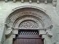 Portal. Note the checkered pattern above the tympanum