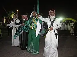 Image 20Saudi males dressed and prepared for ardah, the national dance. It also includes swords, poetry, and singing. (from Culture of Saudi Arabia)