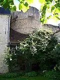 Tower 21, Tour du Puits-Tiphaine in a garden at 10 Rue du Puits-Tiphaine.