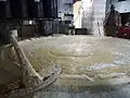The cooking of ingredients is done by Al Tabbeekha or the cooks.[17] Photo at the Shaka'a factory.