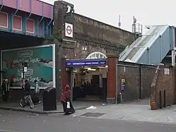 high-level station up stairs on brick viaduct near the market
