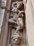 Salabhanjika style statues adoring the outside wall of the temple.