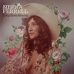 A photo of Ferrell looking up, surrounded by flowers