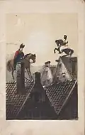 Sinterklaas and his servant on the roof (1850)