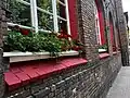 Beautiful window boxes of flowers are seen around to town, 2024