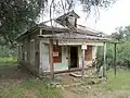 A small frame house.
