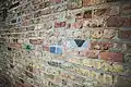Brick Wall with a few colorful bricks