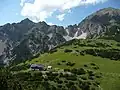 The Solsteinhaus, following its 2007 renovation, in front of the Kuhljochspitze (left) and Erlspitze (right)