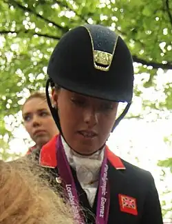 Photo of Sophie Wells signing autographs