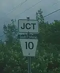 A township road marker of the typical trapezoidal shape in South Frontenac Township, Frontenac County, Ontario. This marker is of South Frontenac Township Road 10.