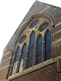 A window of the former parish church of St Michael, Leonard Street, London.