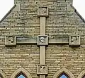 Cross on west wall showing symbols of Evangelists