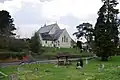 The church hall is to the left of the church