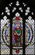 Stained glass depiction (1960s) of St Thomas the Apostle.