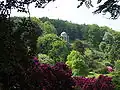 The Temple of Apollo high on a hill overlooking the gardens, based on a circular temple at Baalbec