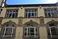 Façade on rue de Phalsbourg (detail): lower part built in 1903, upper part added in 1904